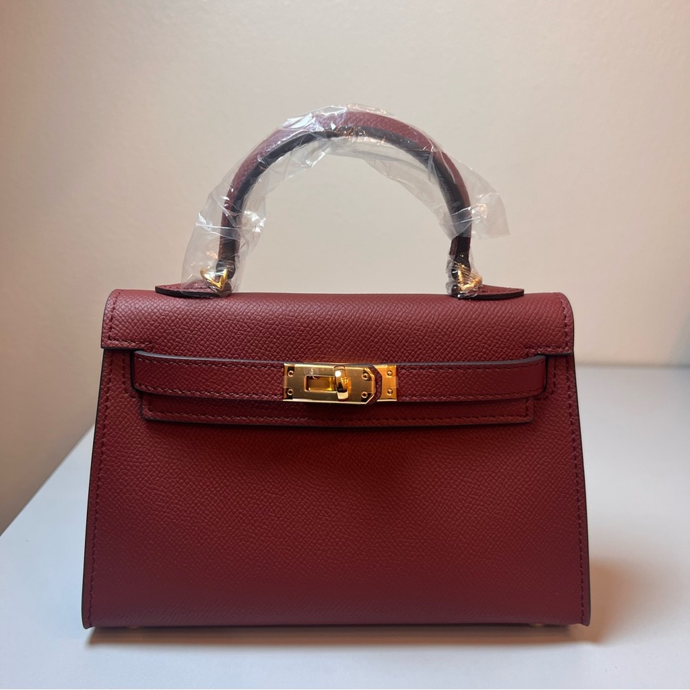 Burgundy Genuine Epsom Leather mini with shoulder strap featuring Gold hardware